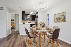 Van Nuys apartment for rent - A modern dining room with a table set for six.