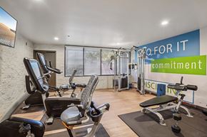 Panorama City apartment for rent - A gym with a sign that says "Go for it commitment".