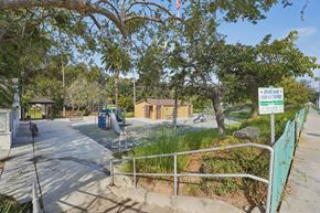Los Angeles apartment for rent - A sign in front of a playground says "BOSSES PARK EXPRESS".