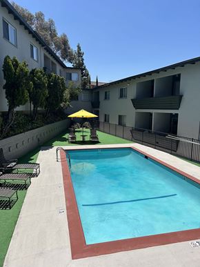Los Angeles apartment for rent - A swimming pool is located on the side of a building.