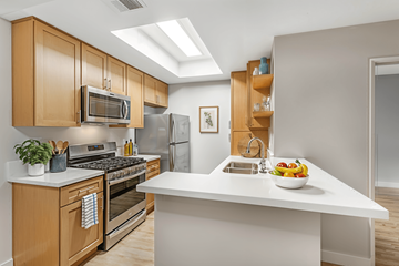 North Hollywood apartment for rent - A modern kitchen with wooden cabinets and stainless steel appliances.