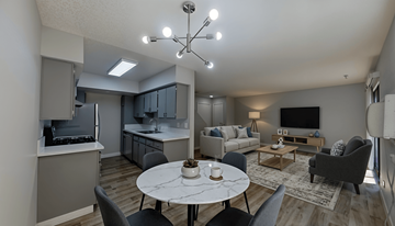 Van Nuys apartment for rent - A modern living room with a dining table and grey chairs.