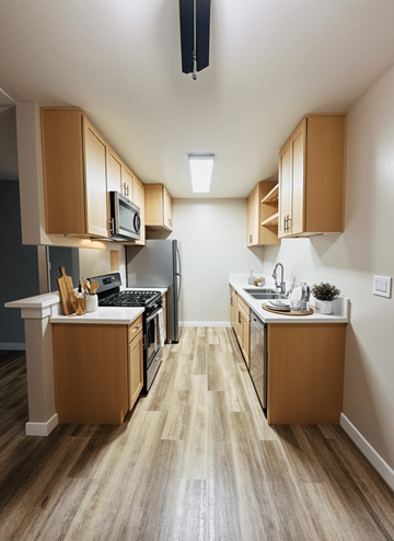 Van Nuys apartment for rent - A kitchen with wooden cabinets and a white counter.