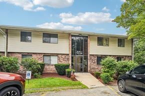 White Oak apartment for rent - A building with a parking sign in front of it.