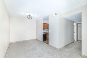 Elizabeth apartment for rent - A room with a kitchenette in the background.