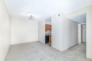 Elizabeth apartment for rent - A room with a kitchenette in the background.