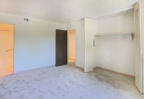 White Oak apartment for rent - A room with a door, a shelf, and a wall socket.