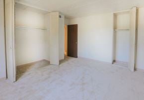 White Oak apartment for rent - A room with a brown door and white walls.