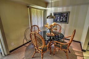 White Oak apartment for rent - Model Apartment: A dining room with a round table and chairs.