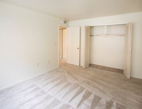 Butler apartment for rent - A room with a carpeted floor and a doorway leading to another room.