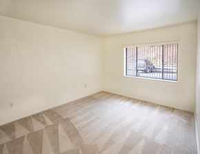 Butler apartment for rent - A room with a window and a car outside.