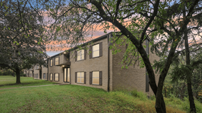 Turtle Creek apartment for rent - A building with a grassy area in front of it.