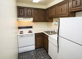 North Huntington apartment for rent - A kitchen with a white fridge, white oven and black stove top.