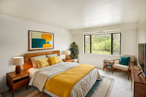North Huntington apartment for rent - A bedroom with a bed, nightstand, and a painting on the wall.