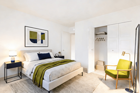 Elizabeth apartment for rent - A bedroom with a bed, a chair, and a lamp.