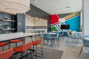 Evansville apartment for rent - A modern dining area with a long table and chairs.