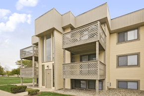 Michigan City apartment for rent - A modern building with a balcony and a window.