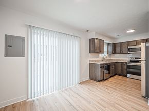 Evansville apartment for rent - A kitchen with wooden floors and a white ceiling.