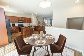 Bear townhouse for rent - a dining room and kitchen with a table and chairs