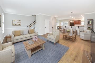 Bear townhouse for rent - a living room with couches and chairs and a table