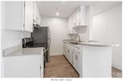 Los Angeles apartment for rent - a kitchen with white cabinets and a stove and a refrigerator at Bonnie Brae Apartments, Apartments, Los Angeles, CA