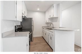 Los Angeles apartment for rent - a kitchen with white cabinets and a stove and a refrigerator at Bonnie Brae Apartments, Apartments, Los Angeles, CA