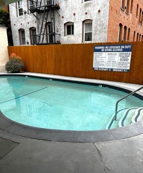 Los Angeles apartment for rent - A pool with a warning sign on the wall.