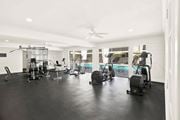 Los Angeles apartment for rent - A spacious gym with a variety of equipment including treadmills, stationary bikes, and weight machines at Bonnie Brae Apartments, Los Angeles