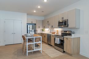 Richmond apartment for rent - A open concept kitchen with stainless steel appliances, modern finishes and undercabinet lighting.