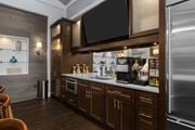 Williamstown apartment for rent - A modern kitchen with dark wood cabinets and stainless steel appliances. at Merion at Cross Keys Apartments, Apartments, Williamstown, NJ
