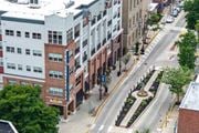 Collingswood apartment for rent - A city street with buildings at The Collings at the Lumberyard, New Jersey