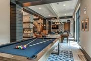 Malvern apartment for rent - A pool table is in the middle of a room with a fireplace and a couch.