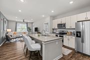 Cranberry Township apartment for rent - A modern kitchen with a large island and stainless steel appliances.