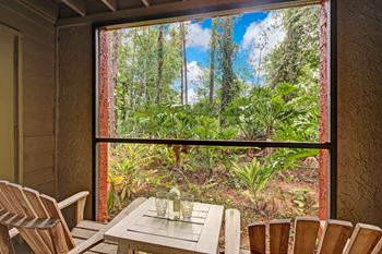 A room with a table and chairs