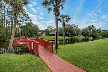 A red bridge over a body of water