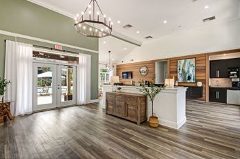 A living room with a kitchen
