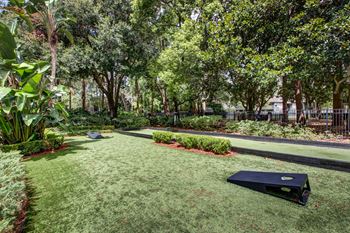 A yard with a ping pong court 