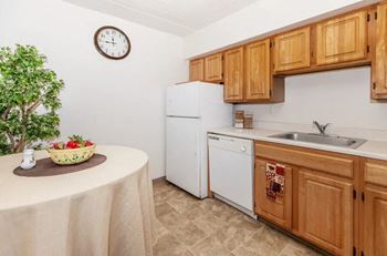 Kitchen with wooden cabinetry and dining area