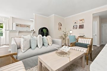 Groton apartment for rent - A living room with a grey couch and a coffee table.