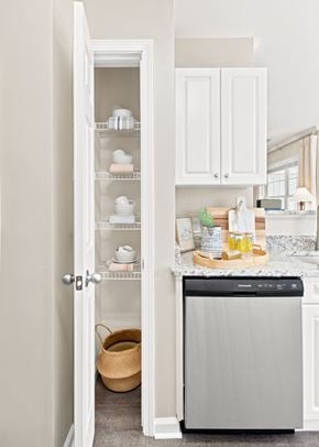 Groton apartment for rent - A kitchen with a dishwasher and an open pantry.