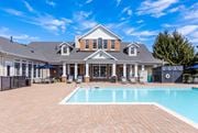 Groton apartment for rent - A large house with a pool in the backyard.