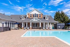 Groton apartment for rent - A large house with a pool in the backyard.