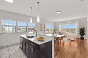 Collingswood apartment for rent - A modern kitchen with a large island and a dining area.