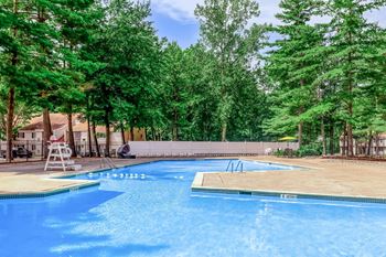 Outdoor pool complex with diving board and deck