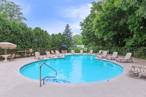Clifton Park apartment for rent - Outdoor swimming pool with lounge chairs at The Crossings at Halfmoon Apartments, Clifton Park, NY