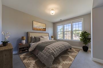 Marlton apartment for rent - A bedroom with a large bed and a painting on the wall.