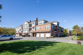Marlton apartment for rent - a large brick building with cars parked in front of it