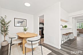 Clifton Park apartment for rent - A modern dining room with a wooden table and chairs.