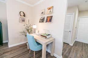 Groton apartment for rent - a bedroom with a desk and a chair and a door at The Ledges Apartment Homes, Groton, CT, 06340
