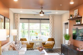 Malvern apartment for rent - a living room with a large window and a ceiling fan at The Yards at Malvern, Malvern, PA